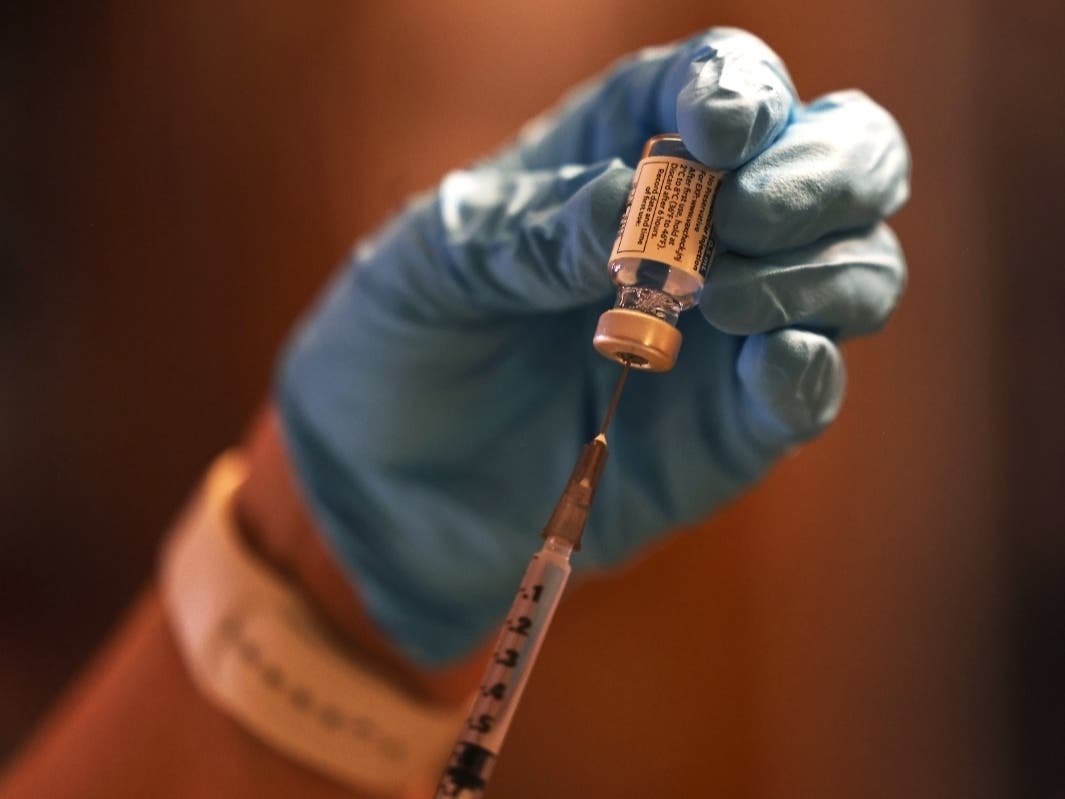 Zenobia Brown, MD, of the Northwell Health house calls program prepares a dose of the Johnson & Johnson coronavirus vaccine in Astoria on April 7.