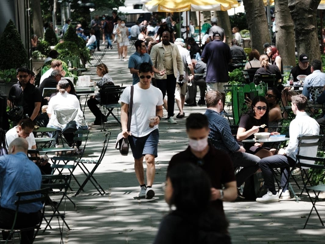 People enjoy a Manhattan park as Covid-19 restrictions have been lifted in New York on May 19.