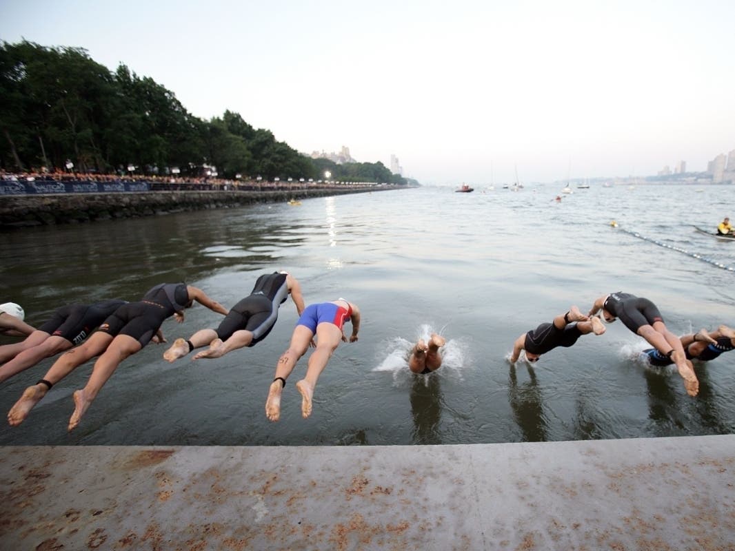 Athletes compete during the New York City Triathlon in the Hudson River on July 18, 2010.