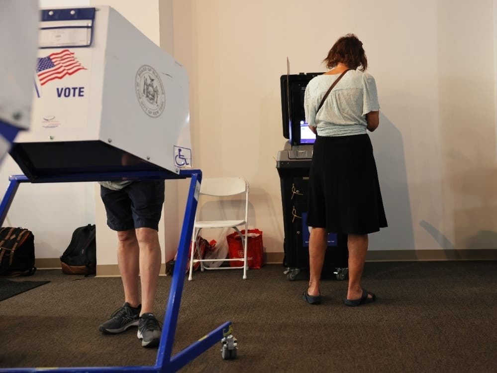 People participate in early voting on June 16 in the Upper West Side neighborhood of Manhattan in New York City.