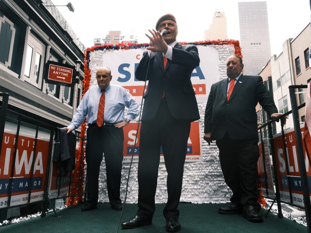 Former New York City Mayor Rudy Giuliani (left) makes an appearance in support of fellow Republican Curtis Sliwa who is running for NYC mayor on June 21. 