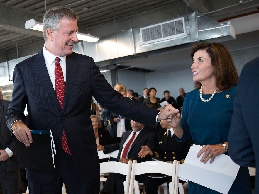 Mayor Bill de Blasio greets Lt. Go. Kathy Hochul as they arrive for an event to commemorate the federal government's return to One World Trade Center on the 63rd floor of One World Trade Center on Sept. 9, 2016.