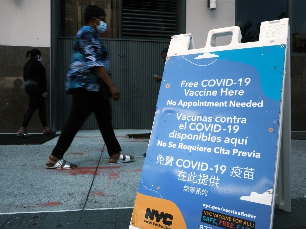 A city-operated mobile pharmacy advertises the COVID-19 vaccine in Brooklyn on July 30.
