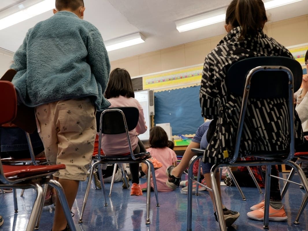 Masked students participate in a lesson in their classroom at Yung Wing School P.S. 124 on Sept. 27.
