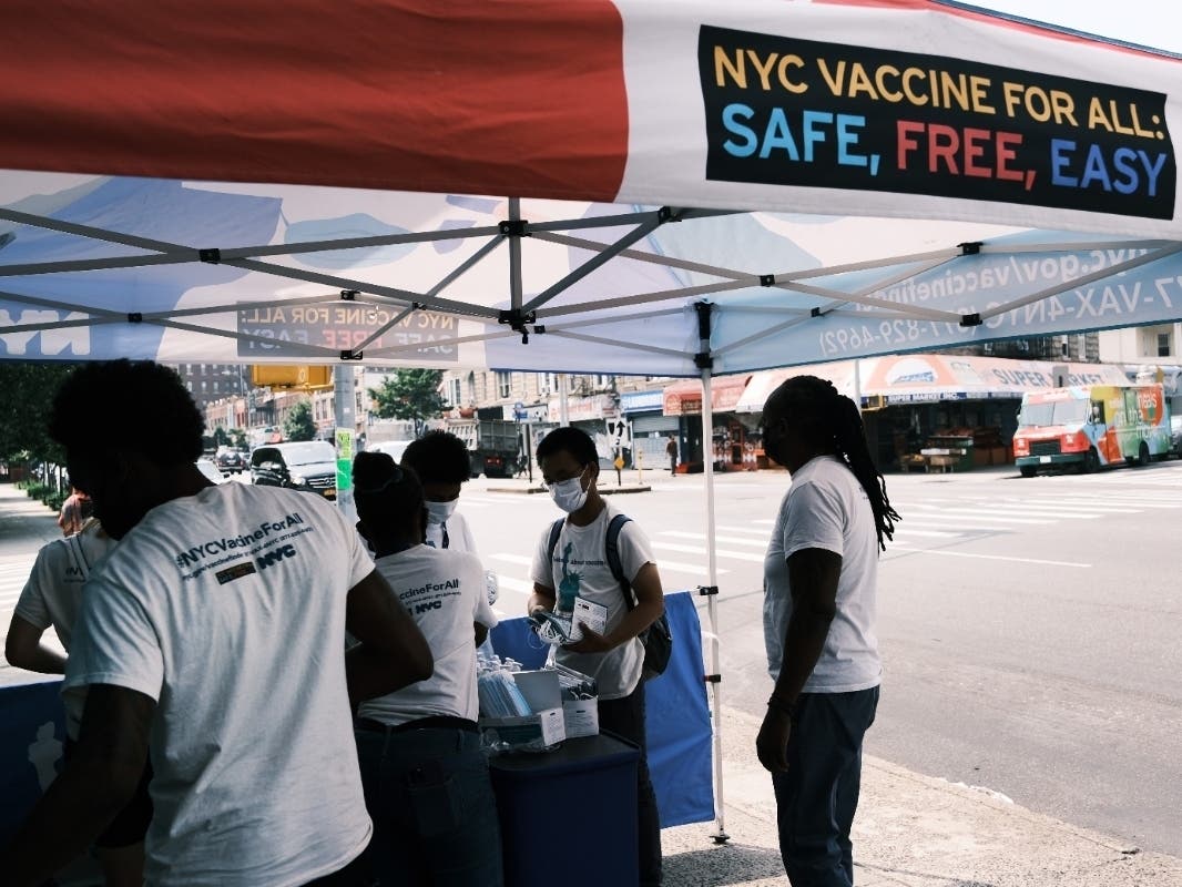 A city-operated mobile pharmacy advertises the COVID-19 vaccine in a neighborhood near Brighton Beach on July 26.