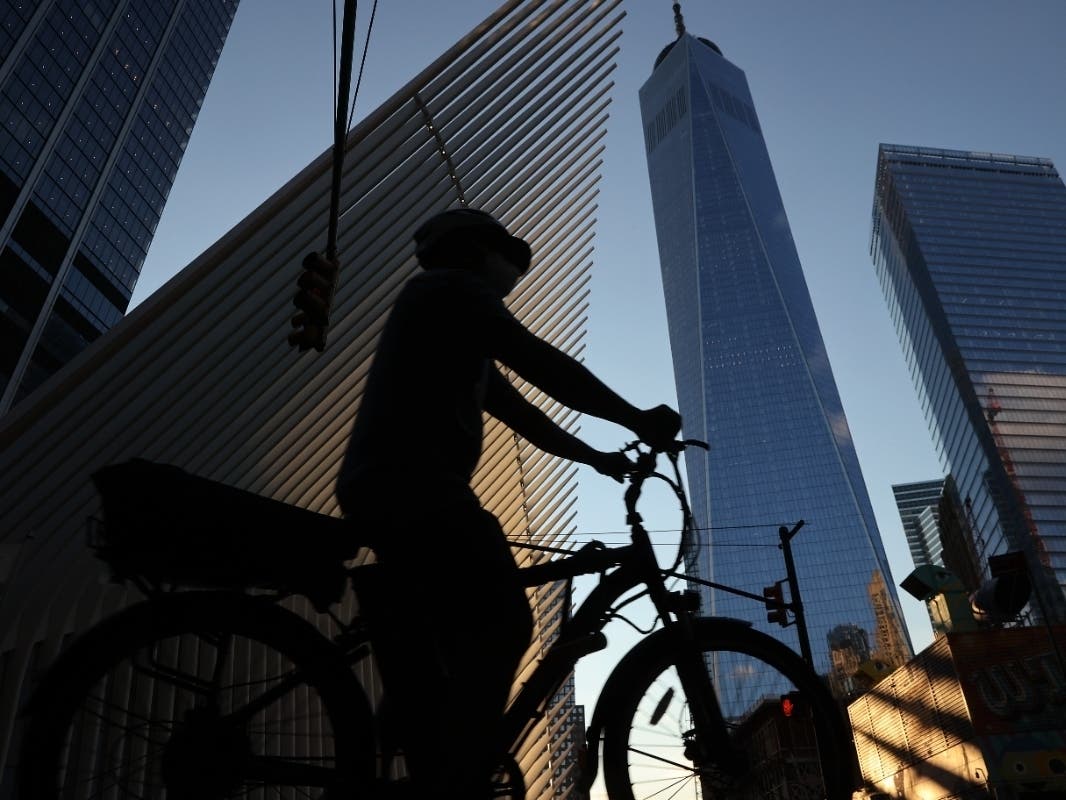 A bicyclist rolls along Church Street near the World Trade Center Transportation Hub's Oculus near the September 11 Memorial on Sept. 6.