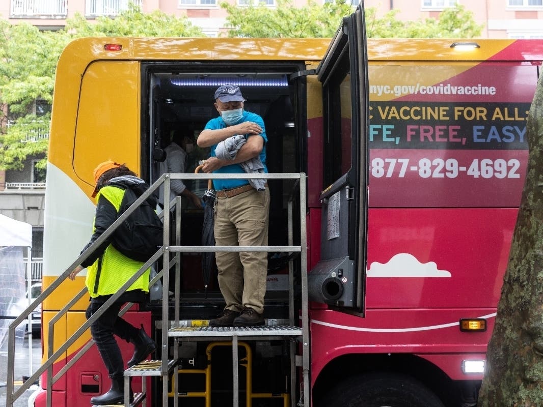 A person leaves a bus after vaccinated at an NYC mobile vaccination clinic bus near Brighton Beach on May 29.