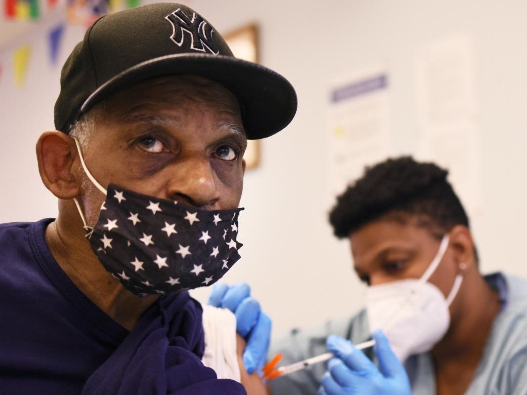 Dove John, 69, is given the Moderna coronavirus (COVID-19) vaccine by Anya Harris at Red Hook Neighborhood Senior Center on Feb. 22.