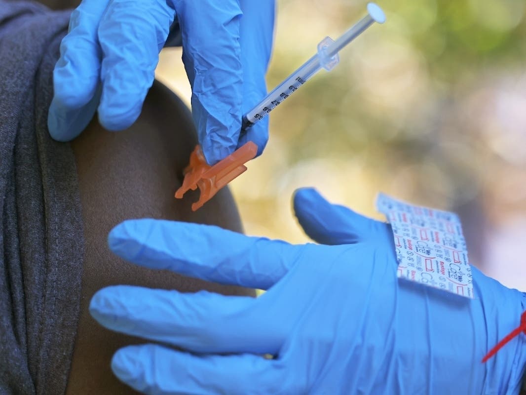 A person receives the Pfizer-BioNTech coronavirus vaccine at a #VAXTOSCHOOL pop-up site at Life of Hope Center on Oct. 21.