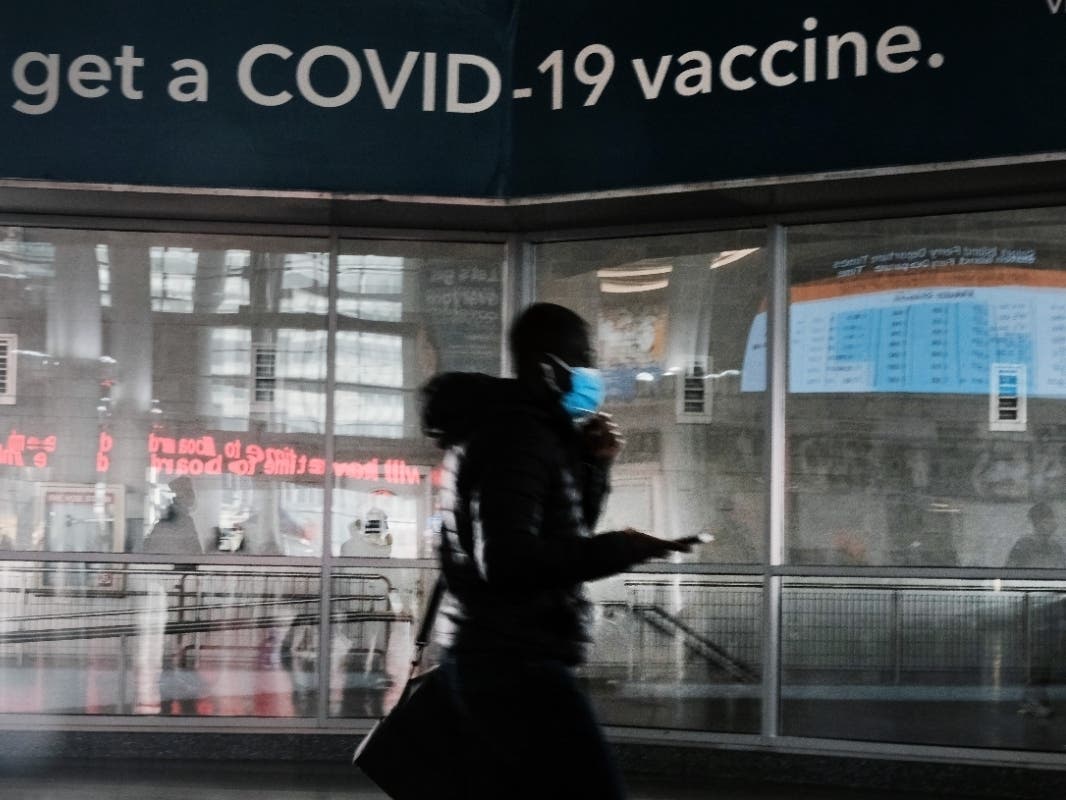  A sign urges people to get the COVID vaccine at the Staten Island Ferry terminal on Monday.