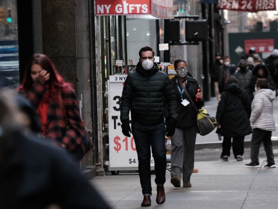 People wear face masks in Manhattan on Nov. 29.