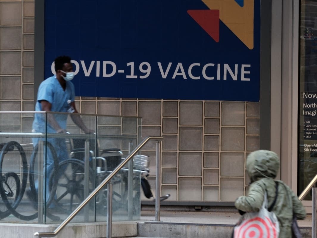 A sign outside of a New York City hospital advertises the COVID-19 vaccine on Nov. 19.