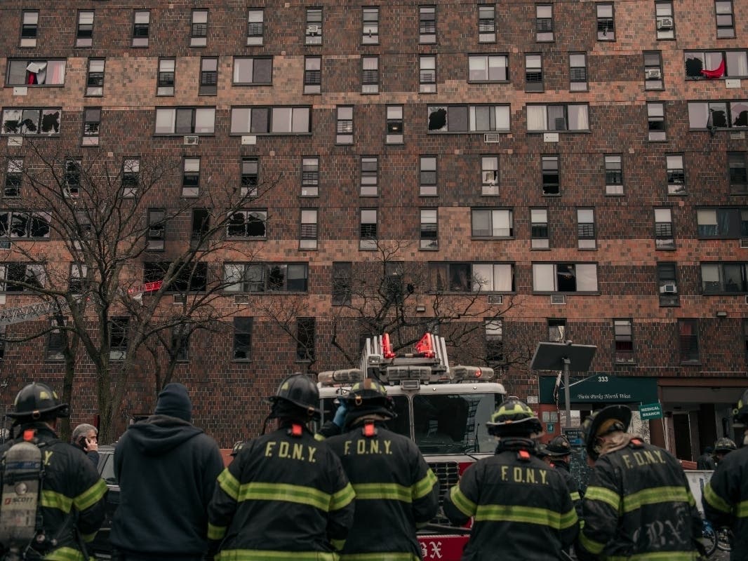 Emergency first responders remain at the scene after an intense fire at a 19-story residential building that erupted Sunday morning.
