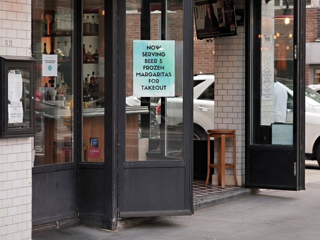 A sign in a restaurant window advertises beer and margaritas for takeout during the coronavirus pandemic on May 19, 2020 in New York City. 
