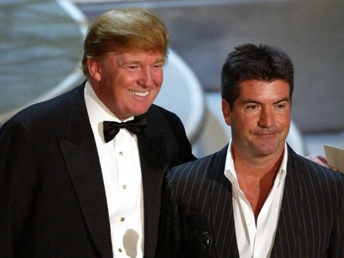 Trump joins Simon Cowell at the 2004 Emmy Awards.