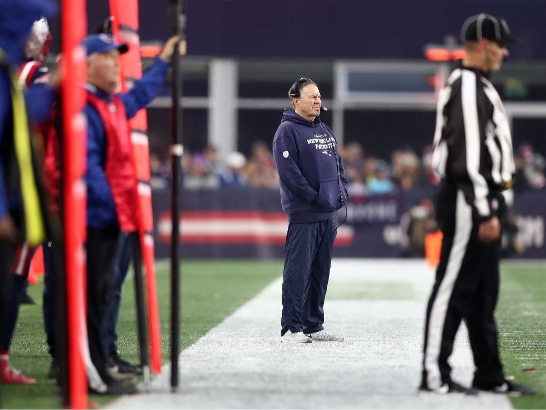 Head Coach Bill Belichick of the New England Patriots looks on from the sidelines in the fourth quarter of the game against the Jacksonville Jaguars at Gillette Stadium on January 02, 2022 in Foxborough, Massachusetts.