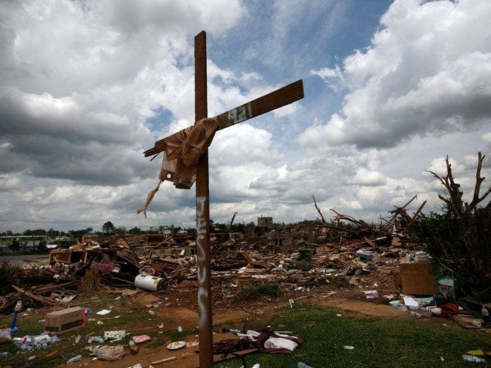 A cross stands over a destroyed neighborhood on May 2, 2011 in Tuscaloosa, Alabama after the tornado that hit on April 27. 