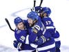 Victor Hedman #77 of the Tampa Bay Lightning is congratulated by his teammates after scoring the game-winning goal during the second overtime period to give his team the 3-2 victory against the Boston Bruins in Game 5.  