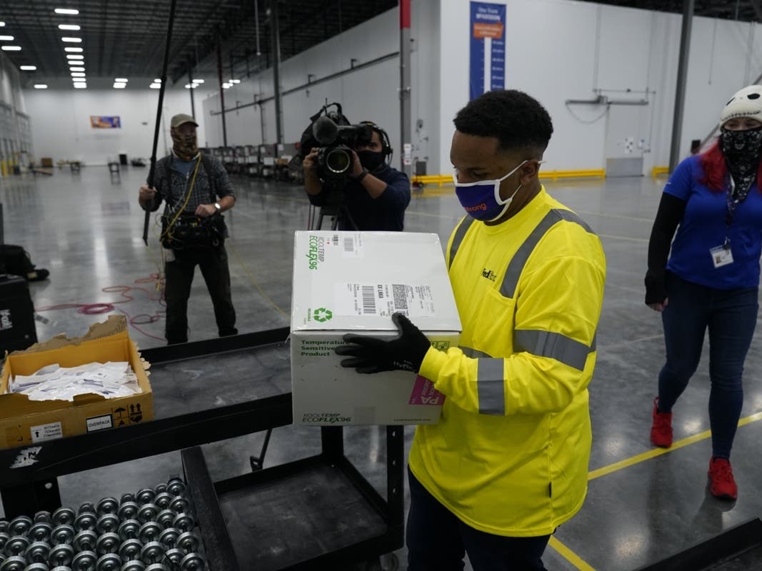 OLIVE BRANCH, MS - DECEMBER 20: Boxes containing the Moderna COVID-19 vaccine are prepared to be shipped at the McKesson distribution center on December 20, 2020 in Olive Branch, Mississippi. 