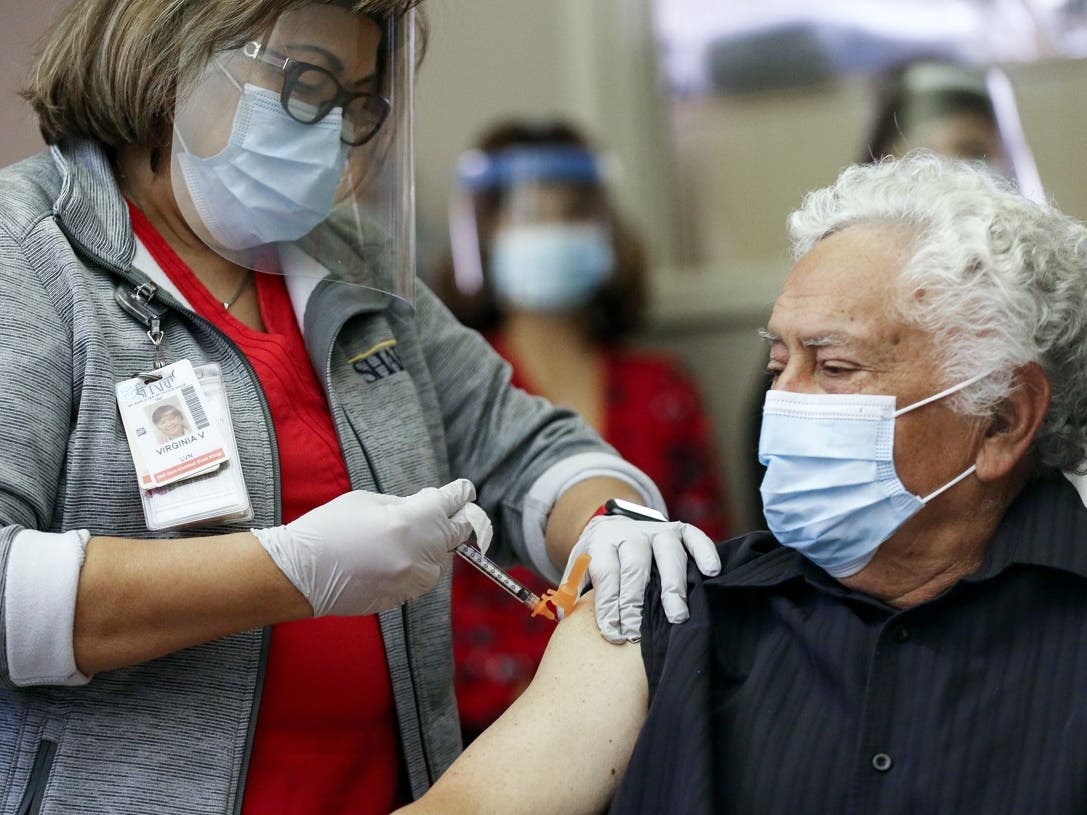 CHULA VISTA, CALIFORNIA - DECEMBER 21:  72-year-old Alegre is the first patient to receive the vaccine in San Diego County. Long-term care patients and frontline workers are among those in the CDC’s highest priority group for vaccination. 