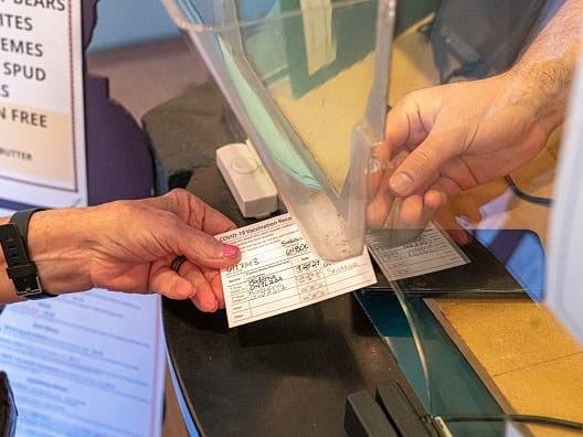 Two Angelenos were arrested in Hawaii after they were caught with fake vaccine cards to bypass the island's travel requirements, authorities said.