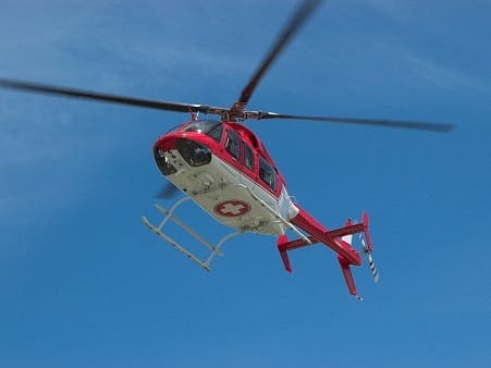 Three people were pulled to safety by helicopter after they were stranded on the face of a steep cliff near Muir Beach on Saturday night, officials said.