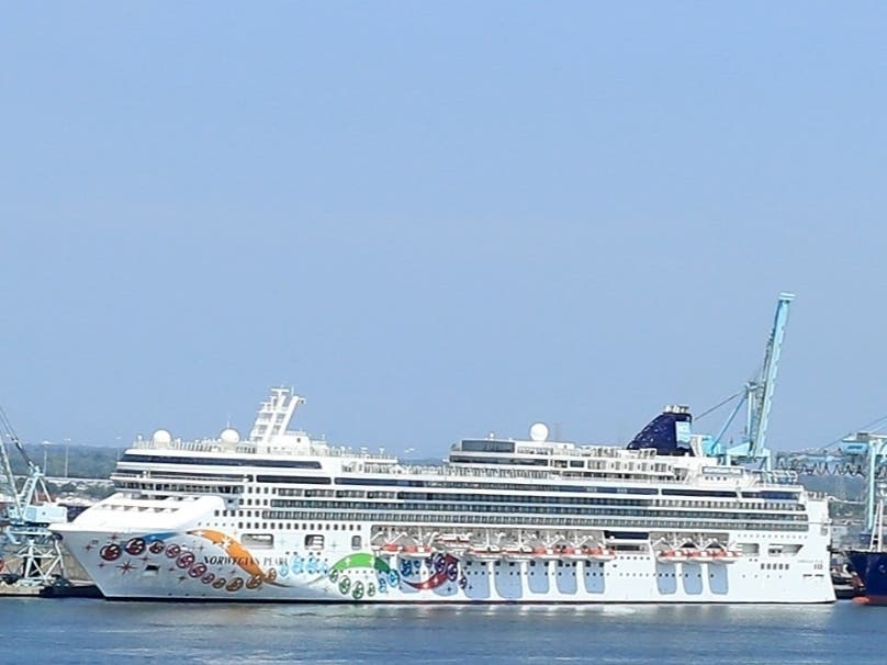 ​Norwegian Cruise Line's Norwegian Pearl cruise ship is shown docked at the Port of Jacksonville. The cruise line has threatened to skip over Florida ports because of the state's ban on vaccine passports.