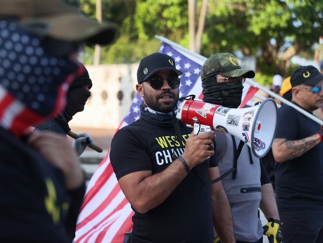 A South FL Proud Boys leader Enrique Tarrio burned a Black Lives Matter banner stolen from a downtown Washington, D.C. church, the Department of Justice said.