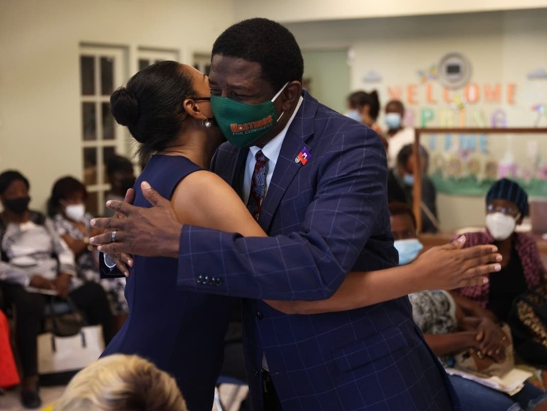 Damara Holness, the 28-year-old daughter of Broward County Commissioner Dale Holness (right), was accused of defrauding the Paycheck Protection Program. She was charged with one count of conspiring to commit wire fraud, the Department of Justice said.