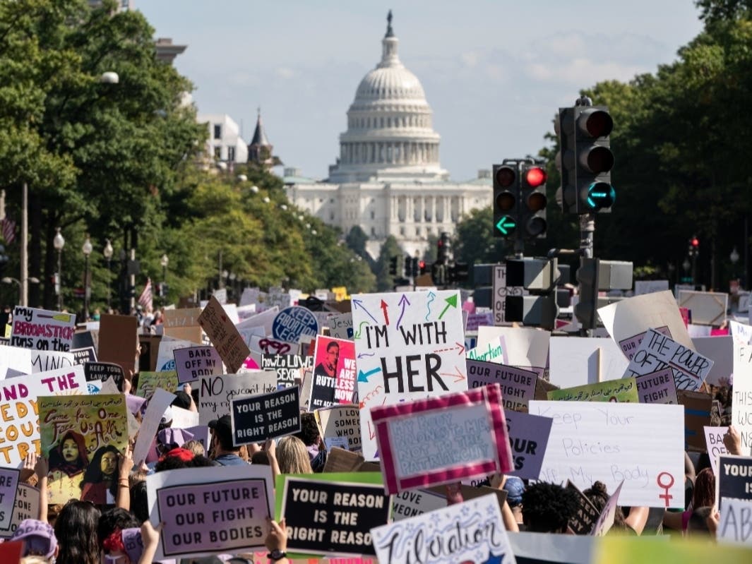 Women rights activists march in Washington, D.C., during the Oct. 2 Women’s March protesting the new abortion law in Texas. More than 1,000 people also marched in Manatee County to protest Commissioner James Satcher’s proposed local abortion restrictions.