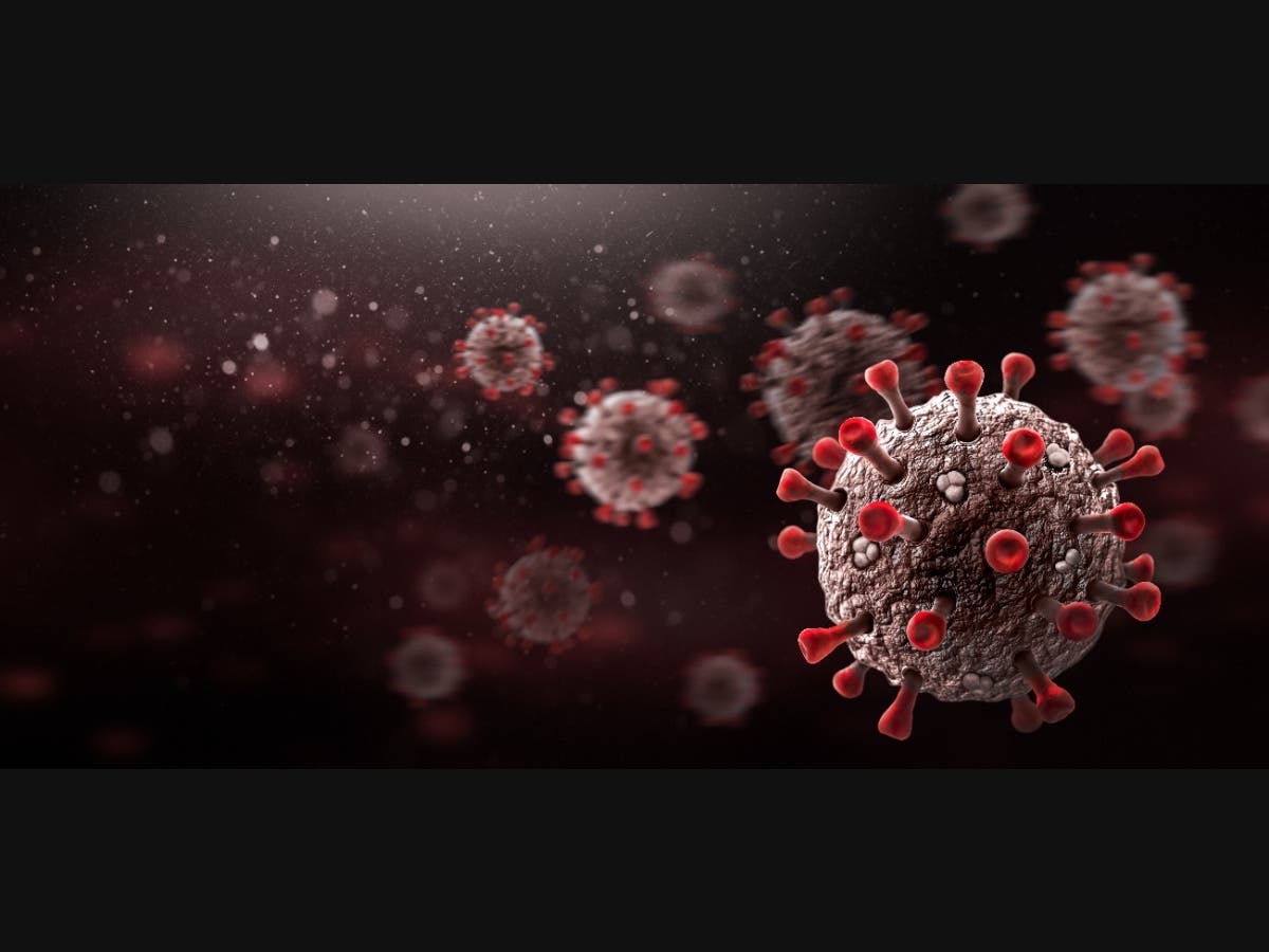 A file image of the coronavirus against a dark background.