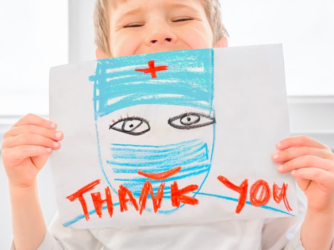 A file photo of a child sending a message of gratitude to doctors and nurses.