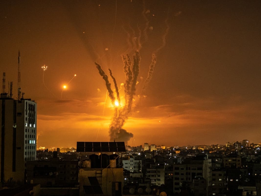 Rockets launched toward Israel from the northern Gaza Strip and the response from the Israeli missile defense system known as the Iron Dome leave streaks through the sky Friday in Gaza City.