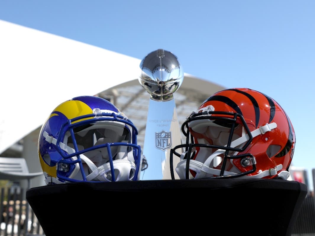 Helmets of the Los Angeles Rams and Cincinnati Bengals sit in front of the Lombardi Trophy before NFL Commissioner Roger Goodell's press conference on Feb. 9, at the NFL Network's Champions Field at the NFL Media Building on the SoFi Stadium campus.