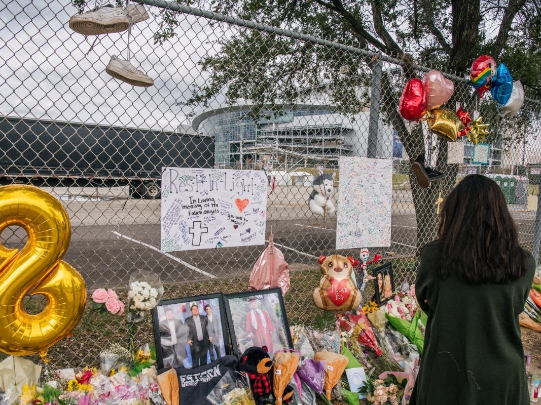  woman views a memorial dedicated to those who died at the Astroworld festival outside of NRG Park on Tuesday in Houston. The investigation into a crowd surge that killed eight people Friday is ongoing.