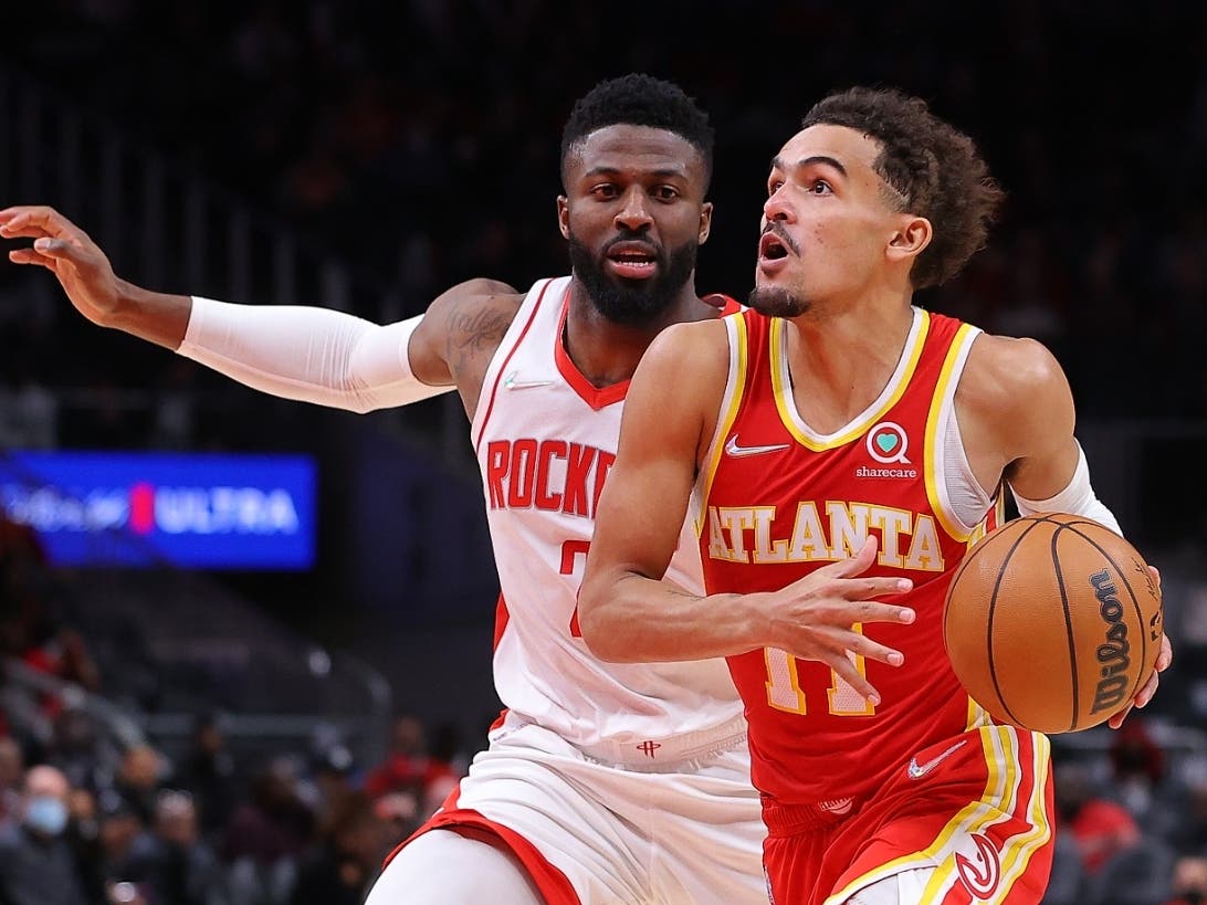 Atlanta Hawks guard Trae Young drives against David Nwaba of the Houston Rockets during the second half at State Farm Arena on Monday in Atlanta, Georgia.