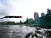 Kevin McDowell dives during the Mixed Relay Triathlon on day eight of the Tokyo 2020 Olympic Games at Odaiba Marine Park on July 31, 2021.
