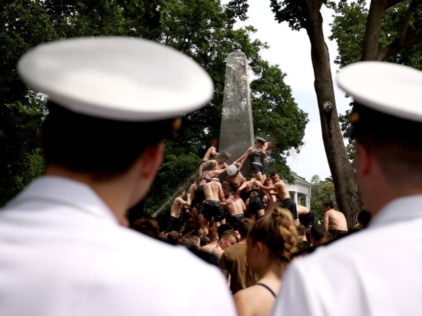 Midshipmen from the class of 2023 will climb the Herndon Monument in Annapolis on Sunday. The United States Naval Academy tradition marks the end of plebian year. The class of 2024 completed the challenge in May. That event is pictured above.