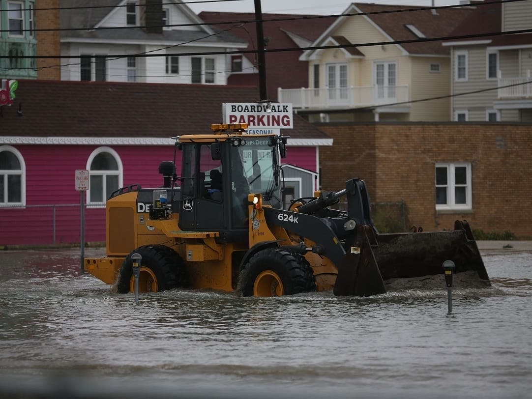 OCEAN CITY, NJ - OCTOBER 30: A loader moves sand washed in from Hurricane Sandy, on October 30, 2012 in Ocean City, New Jersey. Hurricane Sandy made landfall last night on the New Jersey coastline bringing heavy winds and record floodwaters.