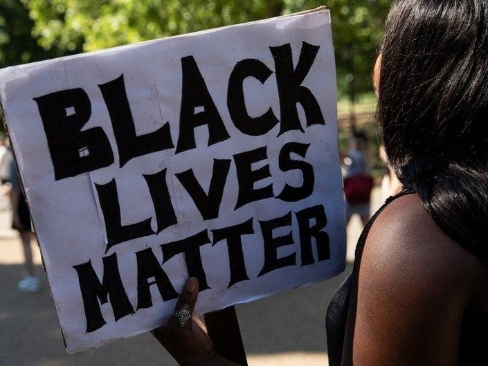 Peaceful demonstrators gathered in Germantown on Sunday to protest the death of George Floyd. Some Montgomery County cops took a knee