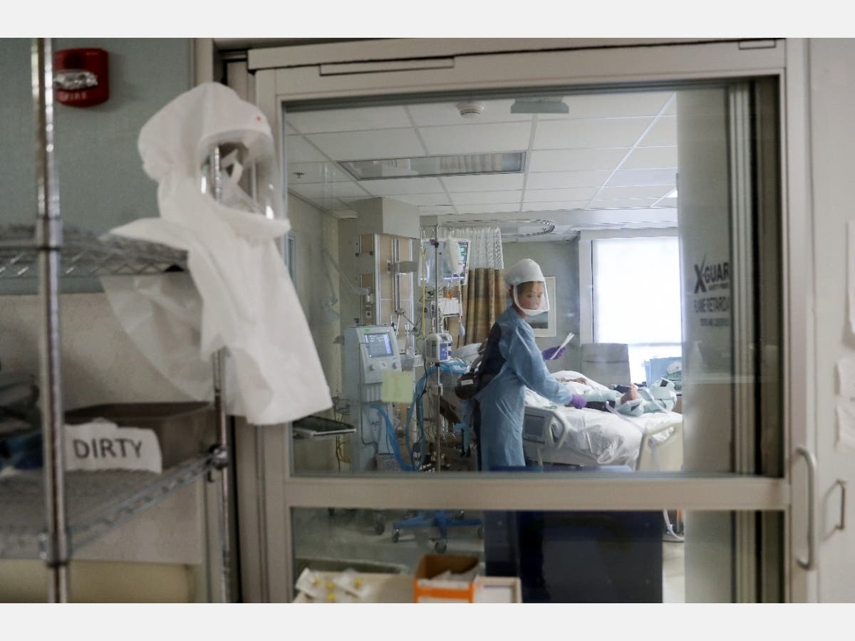 A nurse wearing personal protective equipment (PPE) cares for a COVID-19 patient in the Intensive Care Unit (ICU) at Sharp Memorial Hospital amidst the coronavirus pandemic on May 6, 2020 in San Diego, California.