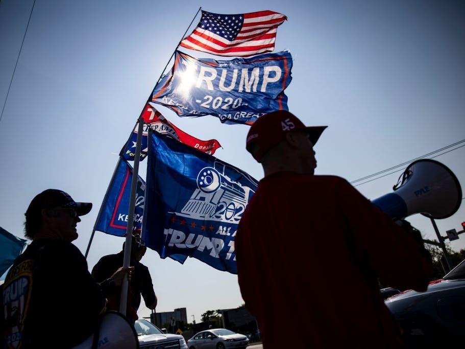 Supporters of President Donald Trump gather outside of Walter Reed National Military Medical Center after the President was admitted for treatment of COVID-19.