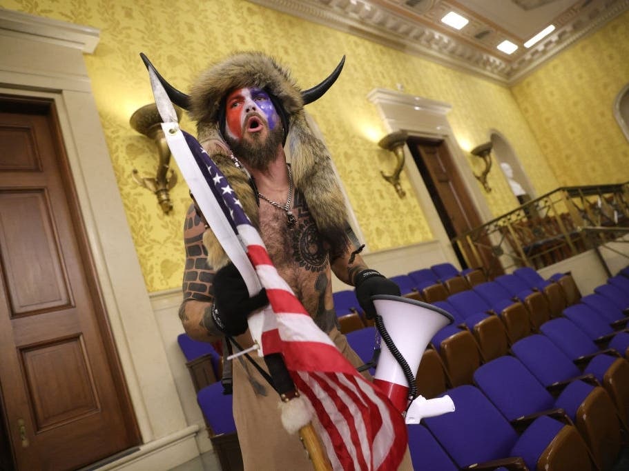 The man in this photo taken during the storming of the U.S. Capitol on Jan. 6 was identified by federal authorities as Jacob Chansley of Phoenix, Arizona.
