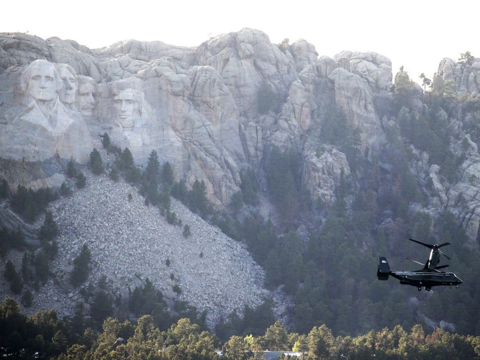 A V-22 Osprey, carrying members of former President Donald Trump's entourage, flies past Mount Rushmore National Monument ahead of a scheduled fireworks display on July 3, 2020 near Keystone, South Dakota. 