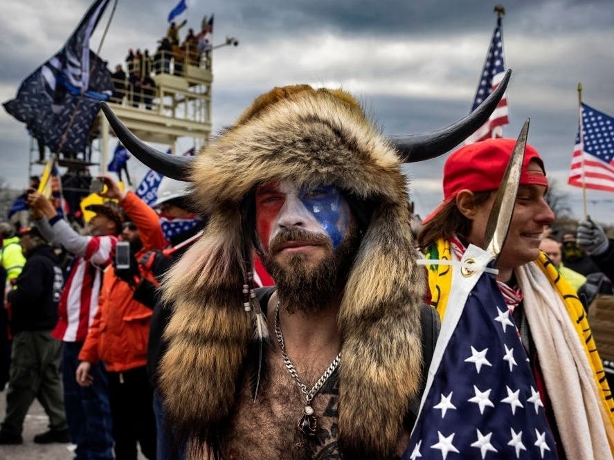 Jacob Anthony Angeli Chansley, known as the QAnon Shaman, is seen at the Capital riots. On January 9, Chansley was arrested on federal charges for his alleged role in the Jan. 6 insurrection on the U.S. Capitol.