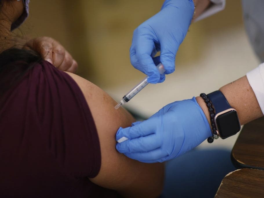 A Moderna COVID-19 vaccine is administered at a clinic set up by Healthcare Network in Immokalee, Florida. A CDC study found the Moderna vaccine is most effective at preventing COVID-19 hospitalization.