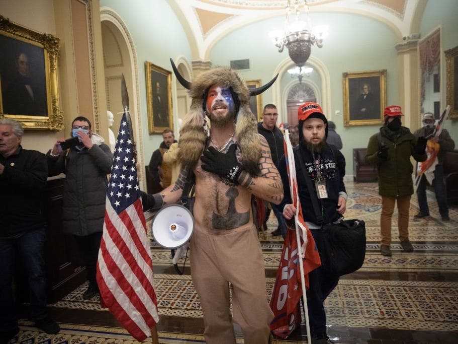 Nicholas Rodean, right, was photographed alongside QAnon Shaman Jacob Chansley during the Jan. 6, 2021, attack on the U.S. Capitol. Rodean was sentenced this week for his role in the breach.