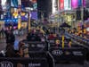 A limited live audience of about 40 first responders and essential workers was allowed to watch the ball drop from a secure area in Times Square.
