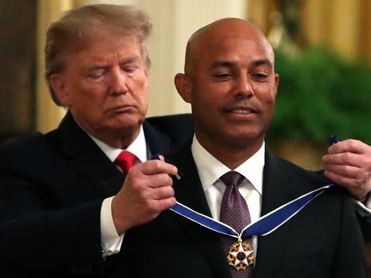U.S. President Donald Trump (L) presents the Presidential Medal of Freedom to former New York Yankees player Mariano Rivera at the White House on Sept. 16, 2019, in Washington, D.C.