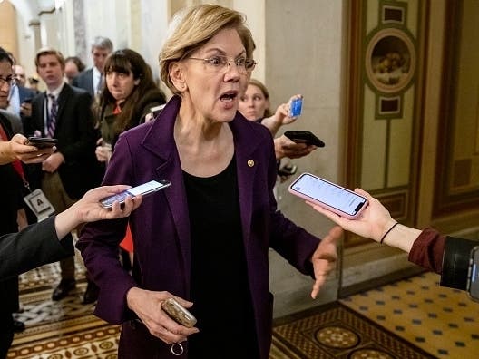 Democratic Presidential Candidate Senator Elizabeth Warren answers questions from the press after leaving the Senate impeachment trial of President Donald Trump Jan, 27 in Washington, D.C.